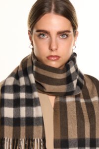 A romantic Valentine’s Day display of pure Scottish cashmere scarves in soft red and ivory tones, styled elegantly with gift boxes