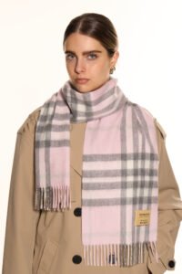 A luxurious display of soft pastel and neutral-toned Scottish cashmere scarves elegantly arranged as Mother’s Day gifts.
