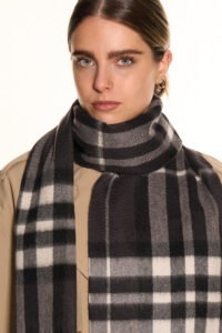 Gift-wrapped cashmere scarf next to a handwritten Valentine’s card