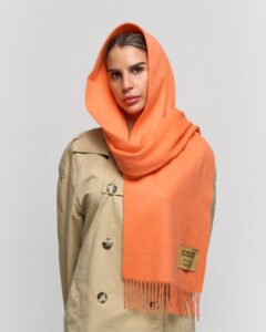 Valentine’s themed flat lay featuring cashmere scarves, roses, and warm lighting