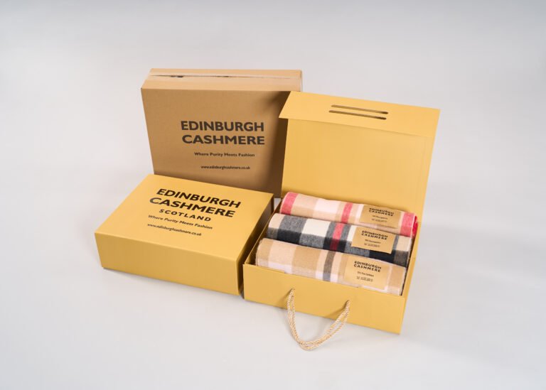 Edinburgh Cashmere exclusive gift box being opened by a recipient